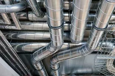 Metal duct runs with elbows inside a building